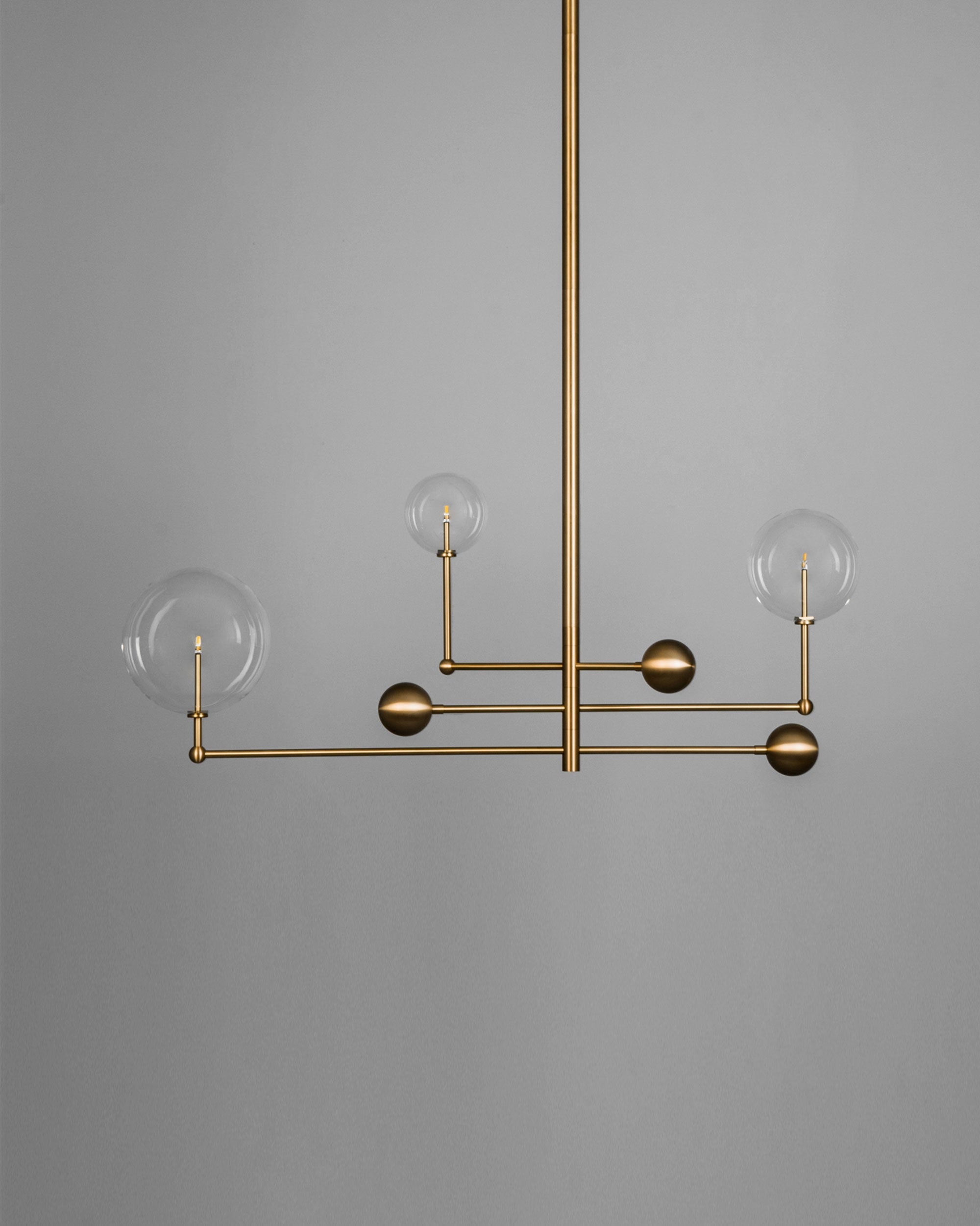Schwung Universe Burnished Brass Transparent Globe Chandelier